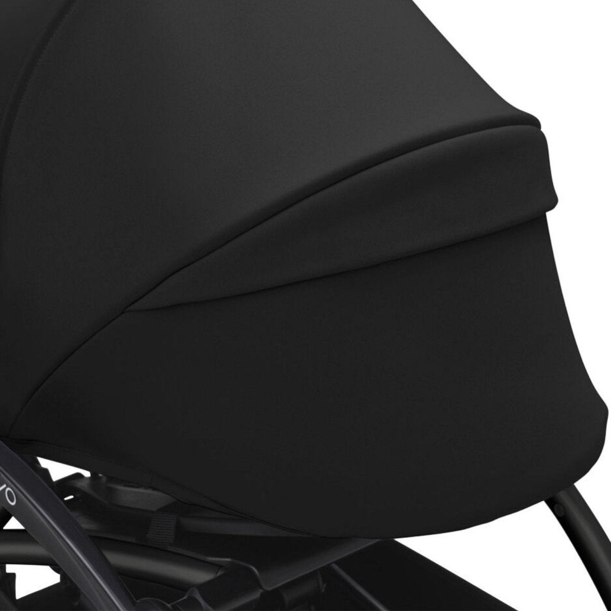 Black stroller legrest and side panel upholstery with curved stitching