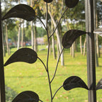 Leaf-pattern metal mesh side panel with netting for a beige gazebo enclosure