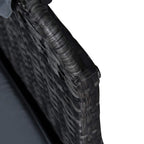 Close-up of dark gray woven wicker arm and gray cushion on outdoor sofa