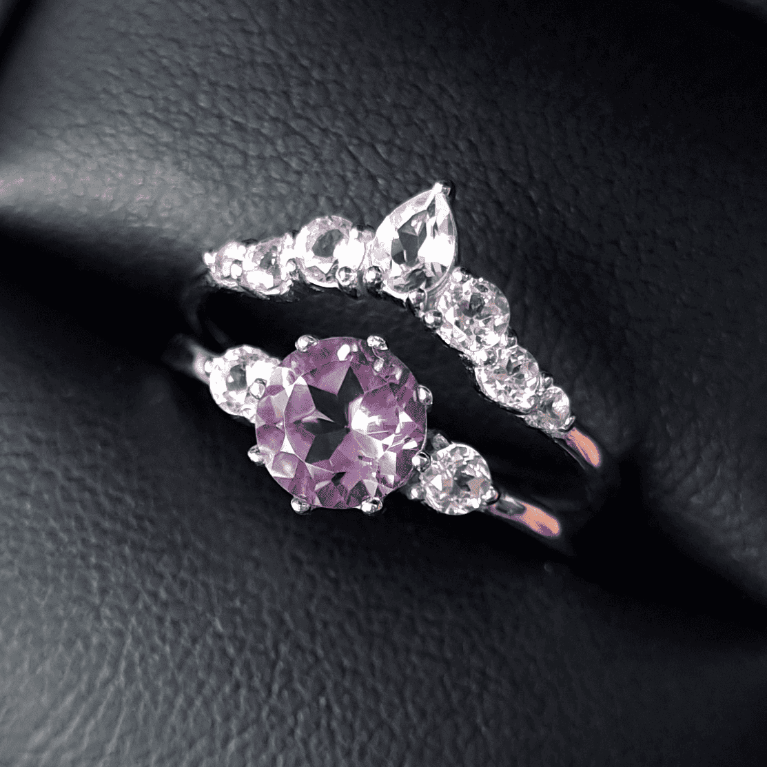 Sterling silver amethyst ring set with halo stones and curved side diamonds