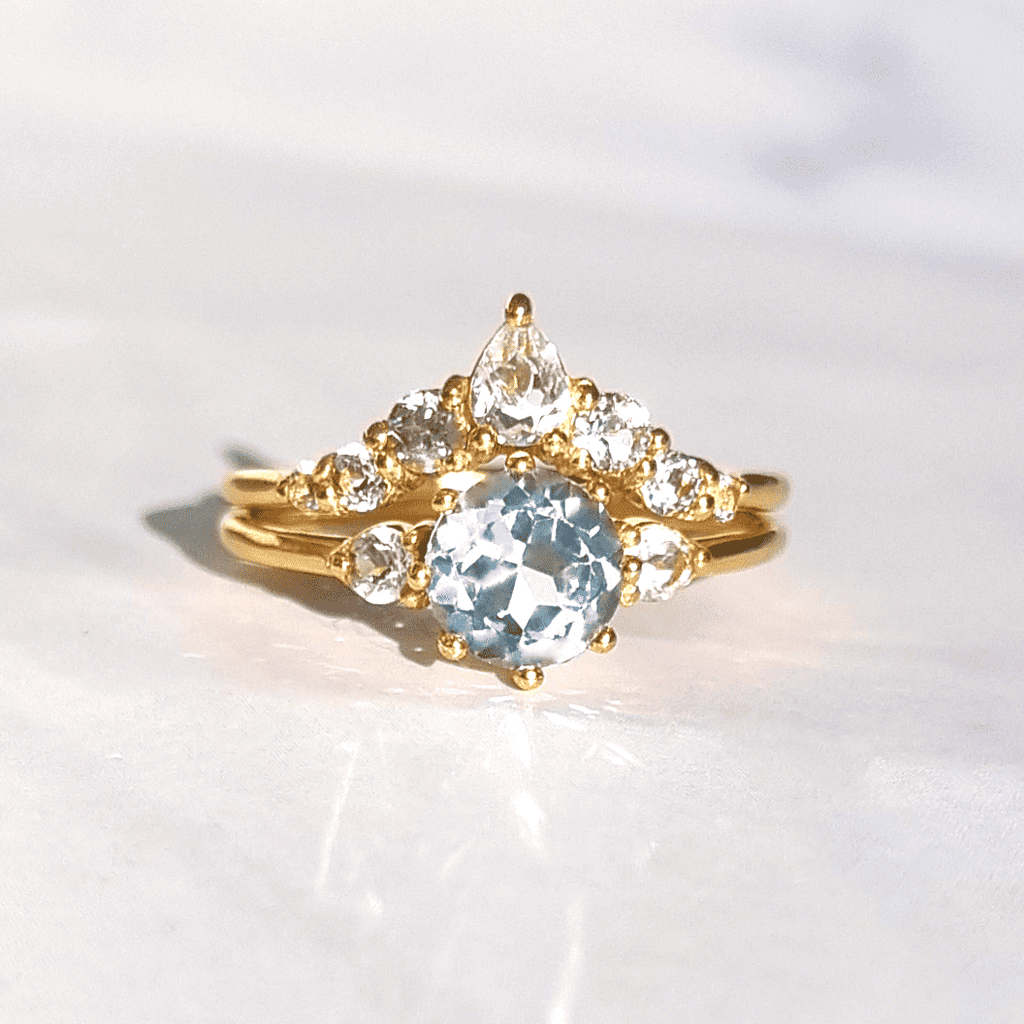 Gold vermeil oval blue topaz ring with round clear stone accents