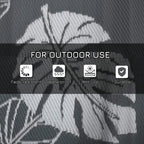 Grey-and-white outdoor rug surface with textured diagonal leaf pattern