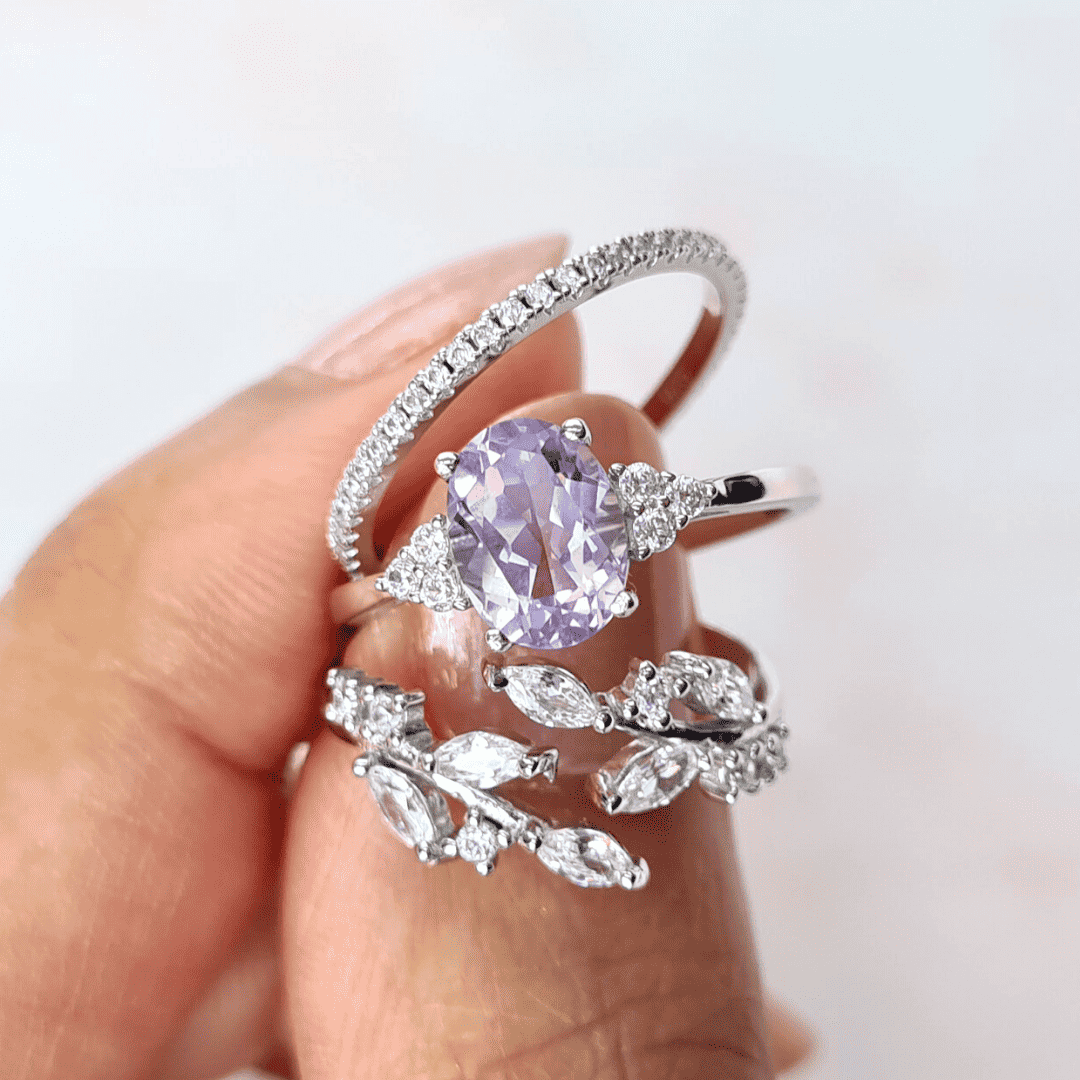 Thin sterling silver eternity ring with pavé stones, shown on a hand