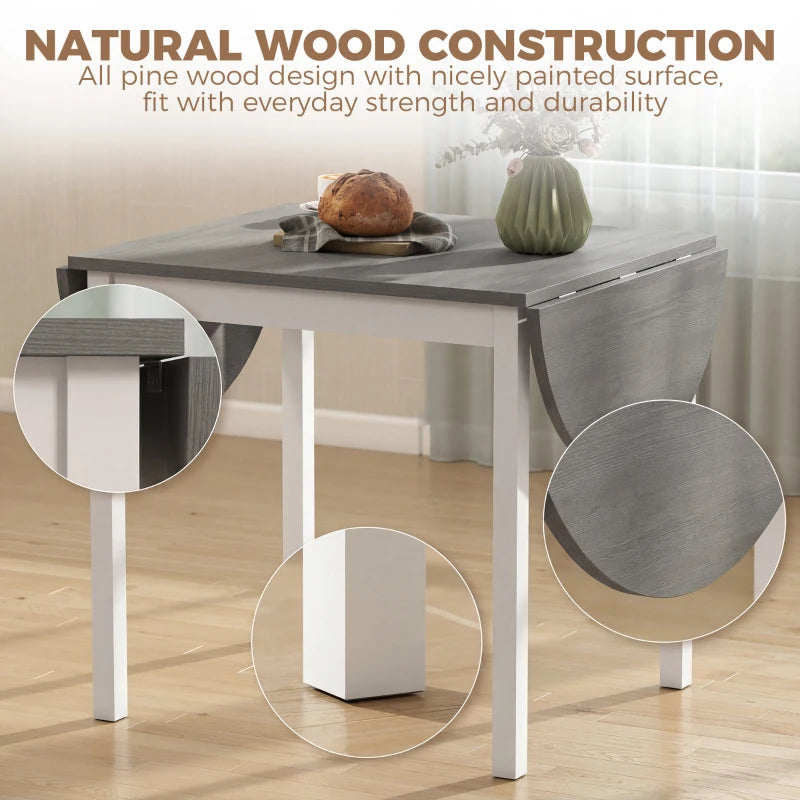 Grey drop-leaf pine wood dining table with white legs, open leaf detail