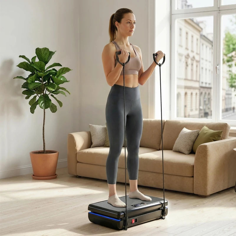 Black vibration plate exercise machine with handles and resistance bands, standing use