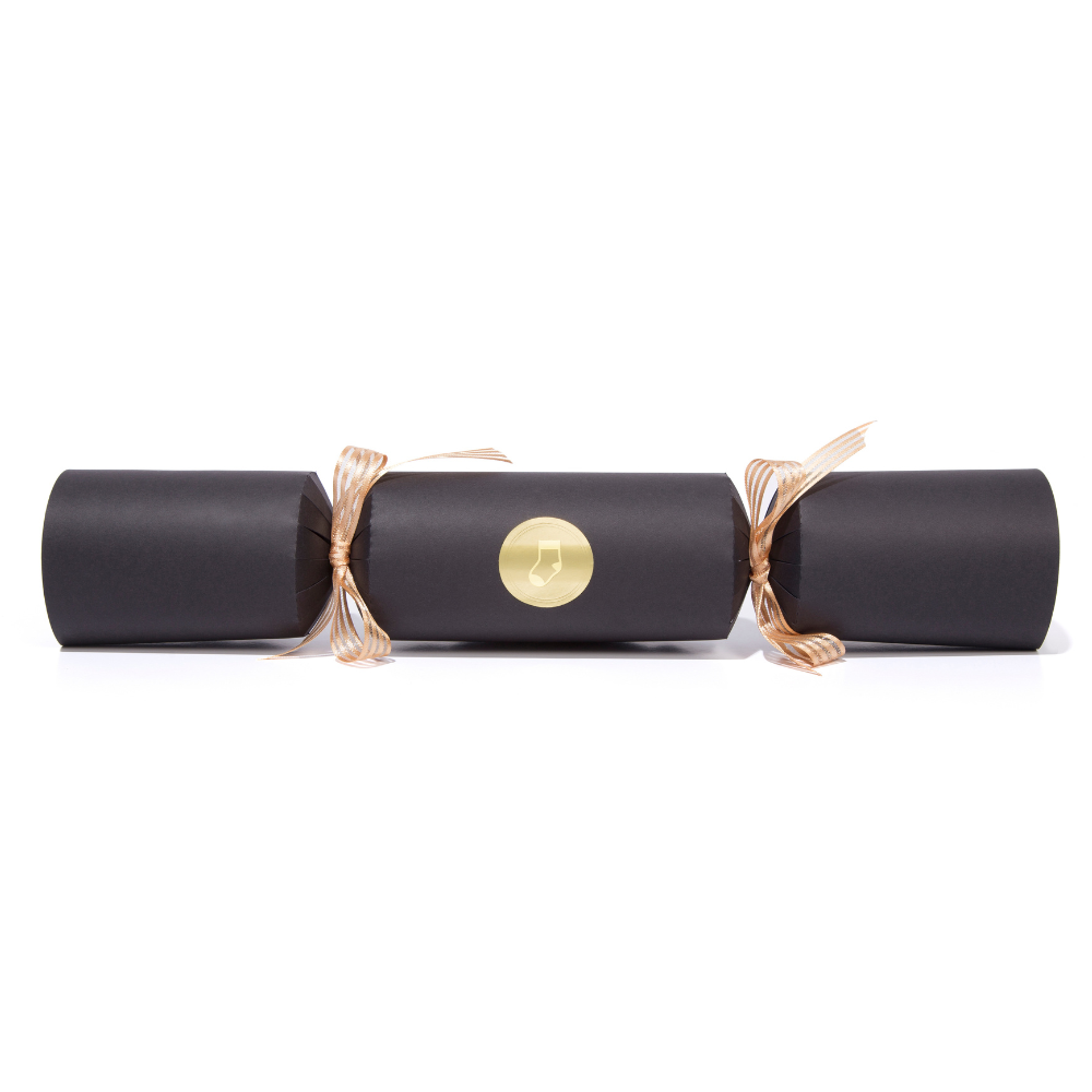 Black Christmas cracker with gold accents on a white background