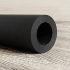 Rolled black exercise mat edge with grippy texture for non-slip grip