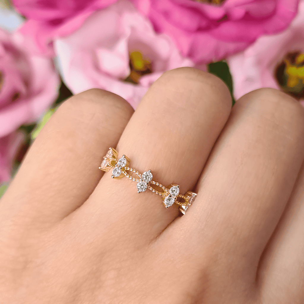 Gold crystal ring with five marquise stones and round accents on an openwork band