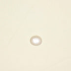Cream canopy fabric close-up with visible texture and small bright water-like spot