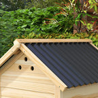 Close-up of natural wood duck house roof with ventilation holes