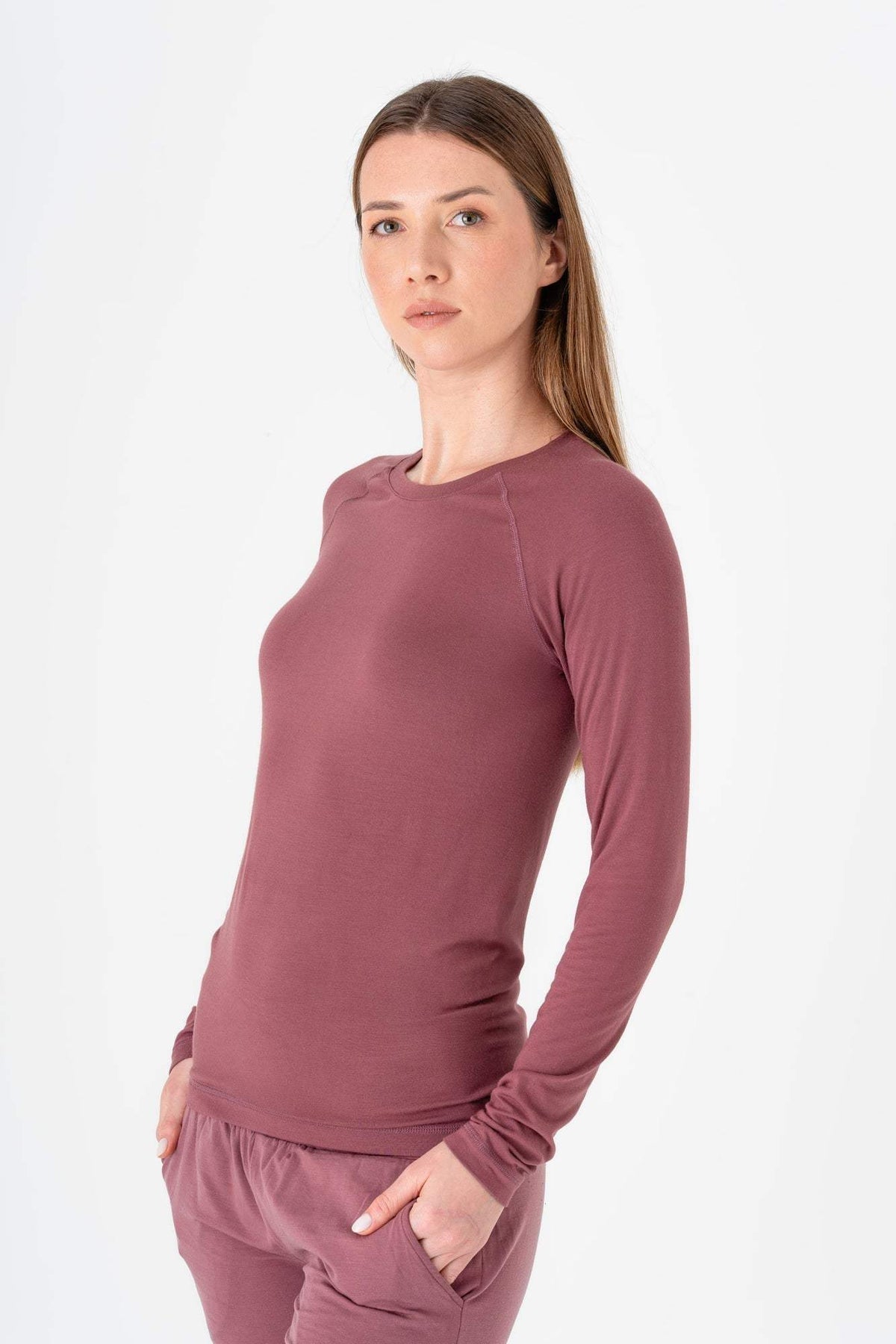 Women’s Tencel long sleeve shirt in mauve, crew neck, fitted, thumb-loop cuffs.