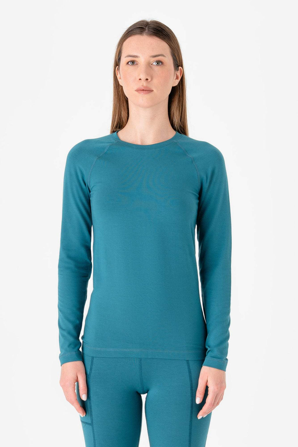Women’s Tencel long sleeve shirt in teal, crew neck, fitted silhouette.