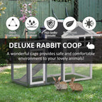 Two-tier wooden rabbit coop with wire mesh panels, ramp, and grey weather-resistant roof