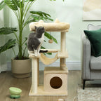 Beige cat tower with top bed, hammock, scratching platforms, and hanging ball