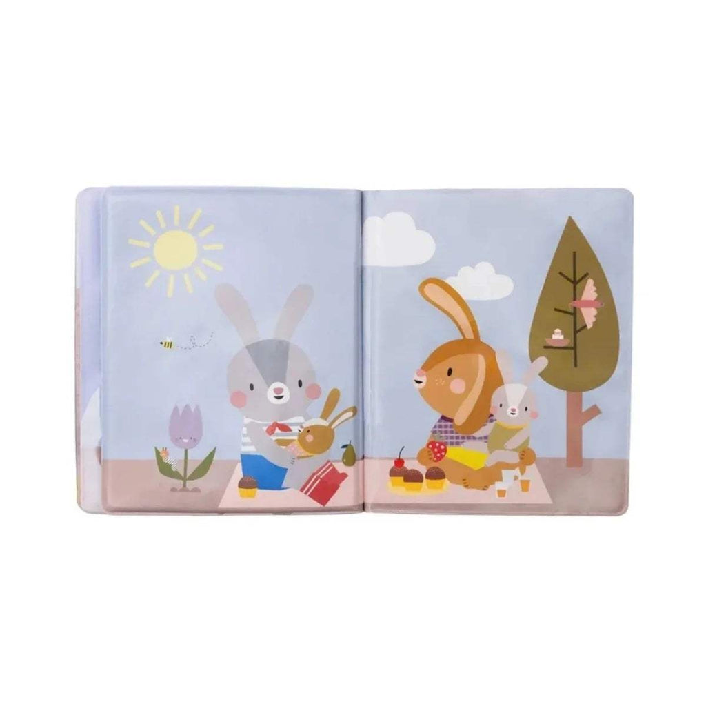 Open peek-a-boo water book with bunny family feeding at picnic table