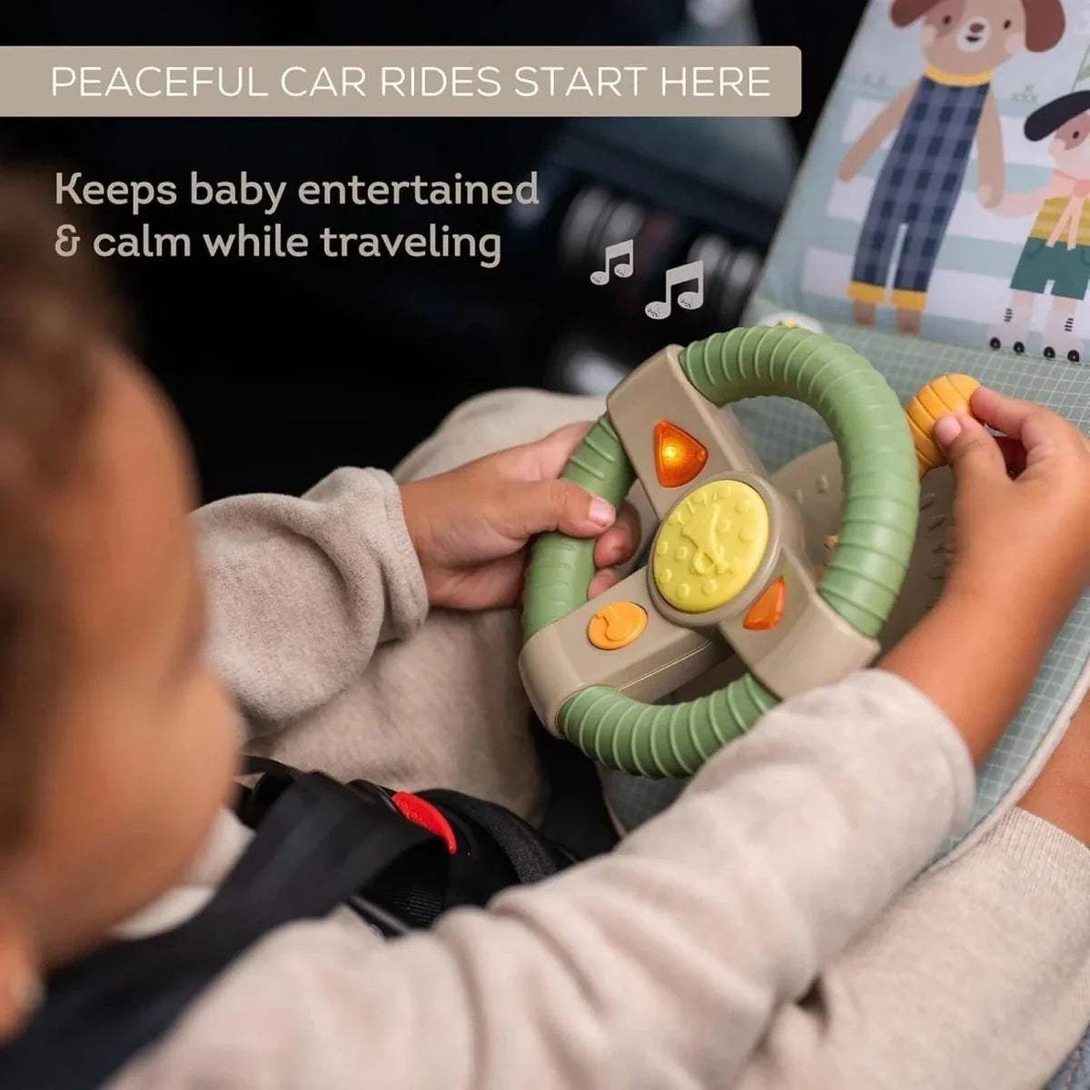 Hands holding car travel toy dashboard: green steering wheel light and gear lever panels