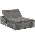 Grey two-seater rattan day bed with two padded back cushions on a woven base