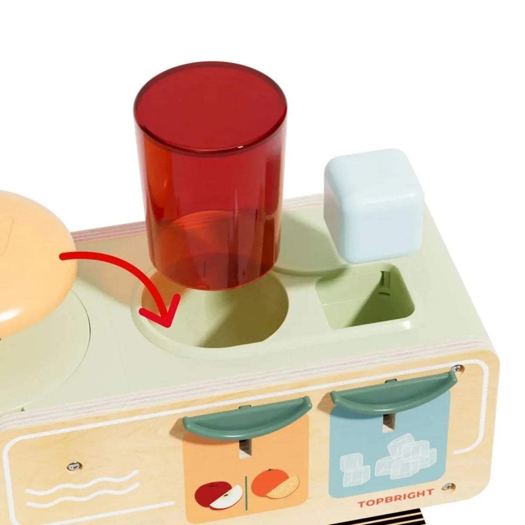 Wooden juice kiosk close-up with red cup and pale ice-cube tray