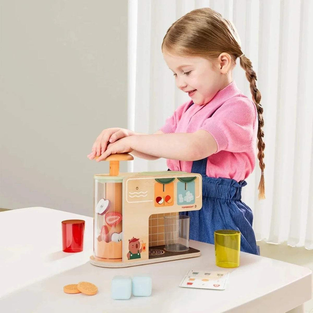 Wooden juice kiosk play set with red, yellow, and pale cups plus ice cubes