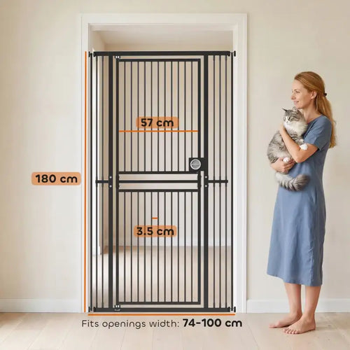 Black pet gate with vertical bars and pull-ring latch, positioned in a doorway opening.