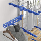Blue side-arm drying wing with clip-on bars for hanging items on a clothes horse