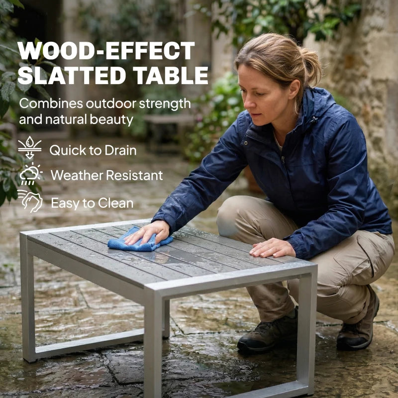 Brushed aluminium slatted coffee table with dark grey cushion pieces