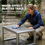 Brushed aluminium slatted coffee table with dark grey cushion pieces
