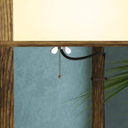 Brown lamp top detail with cord and hanging pull-chain over the upper glass shade