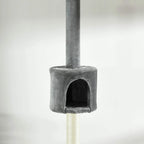 Close-up of light grey cat tree condo with dark entrance and sisal scratching column