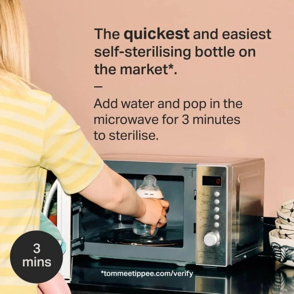 Microwave sterilising bottle setup with a clear baby bottle inside the microwave