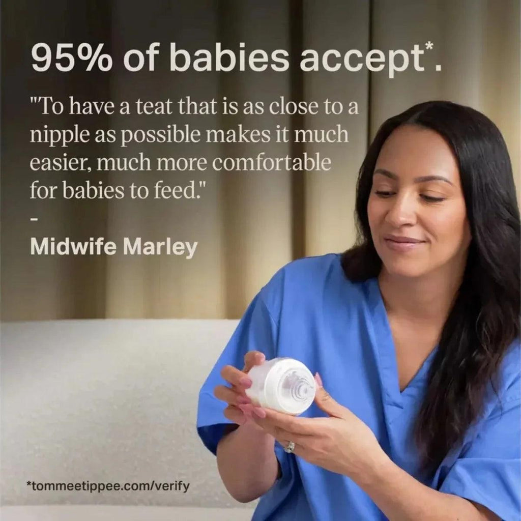 Nurse holding newborn bottle with pink and clear teat for feeding