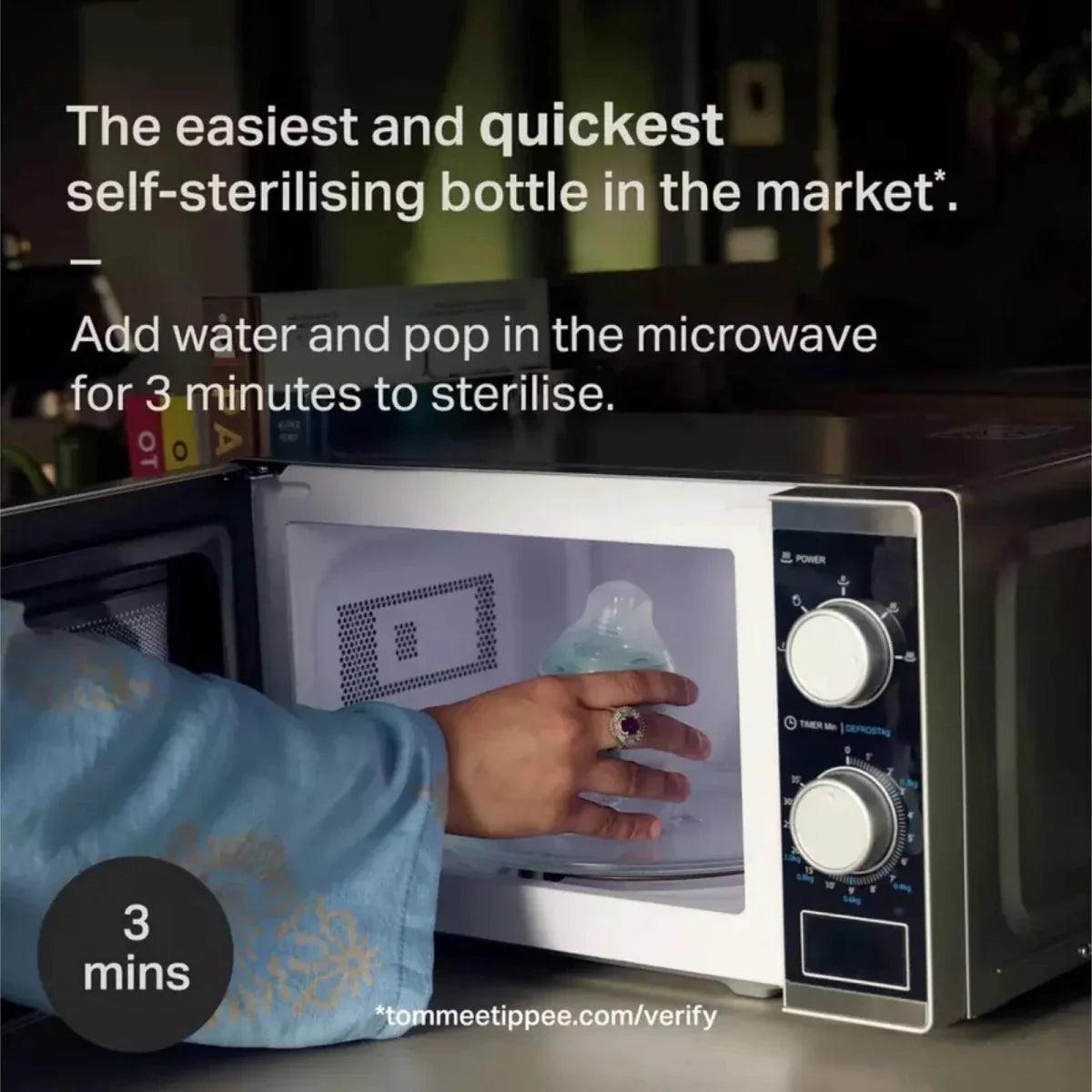 Microwave self-sterilizing baby bottle with cap ready for steaming