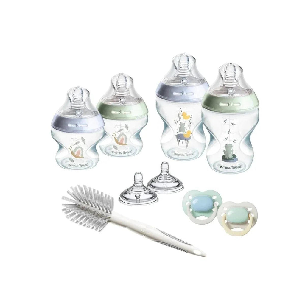 Tommee Tippee newborn starter kit with blue bottles, brush, and pacifiers