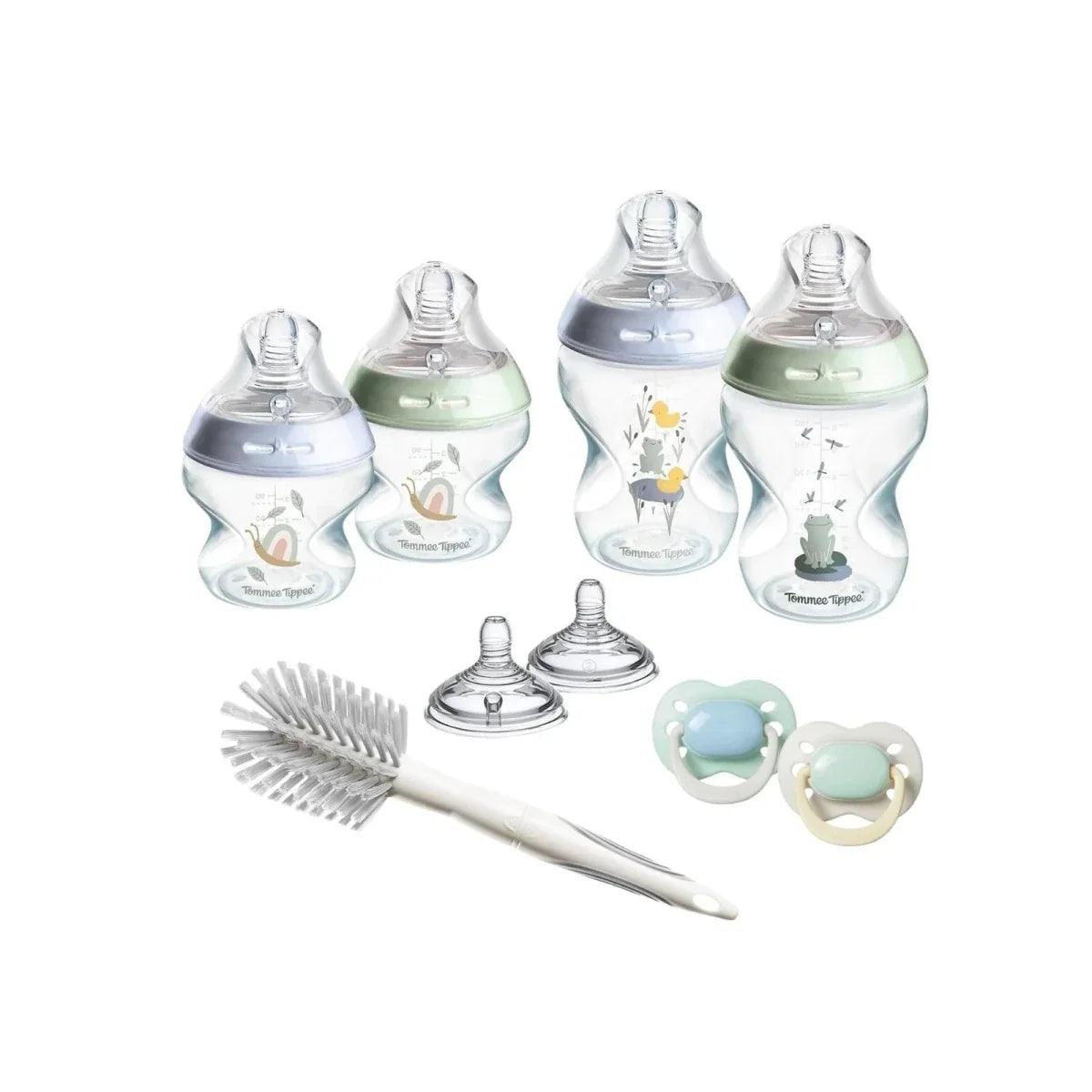 Tommee Tippee newborn starter kit with blue bottles, brush, and pacifiers