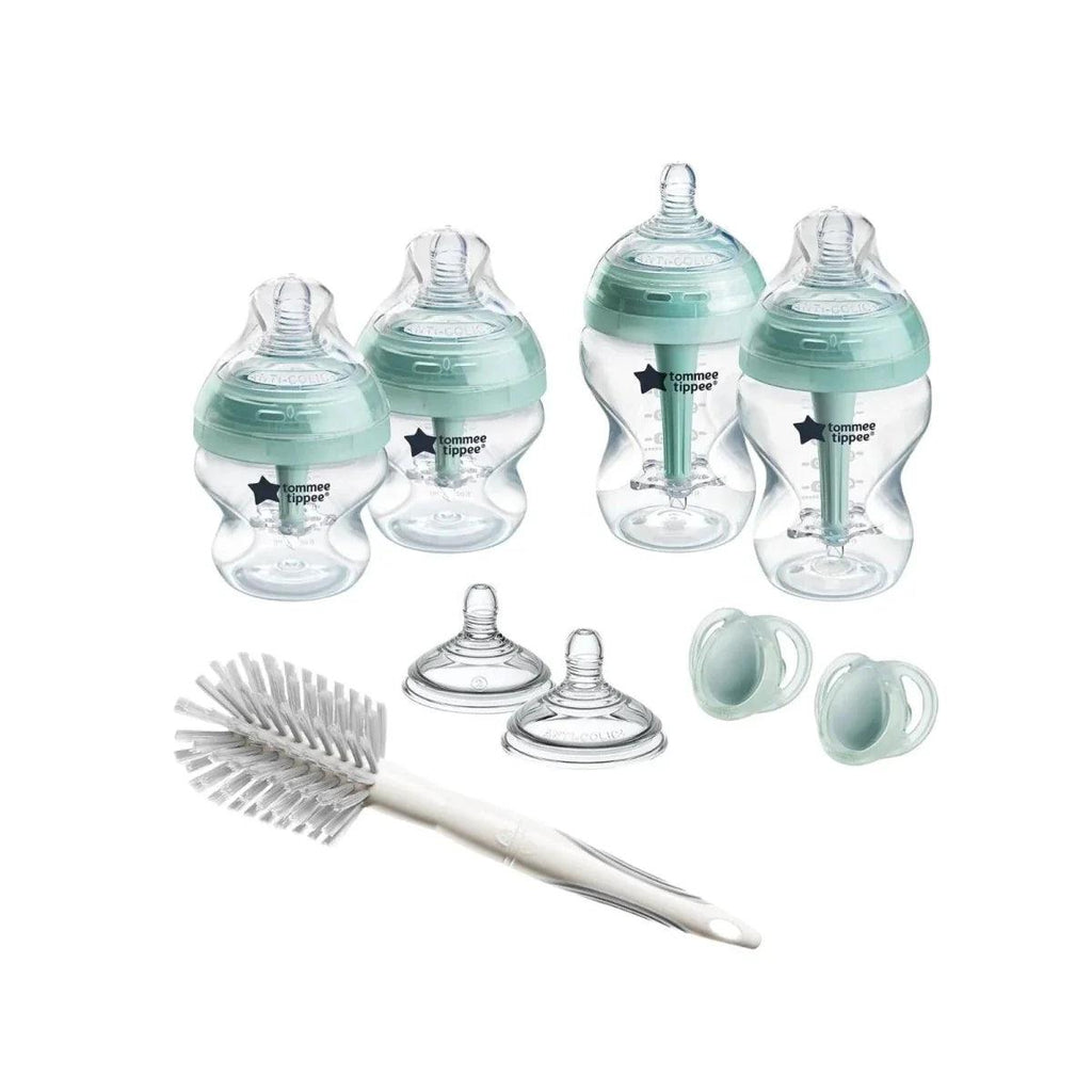 Newborn anti-colic bottle starter set with teal bottles and bottle brush