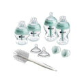 Newborn anti-colic bottle starter set with teal bottles and bottle brush