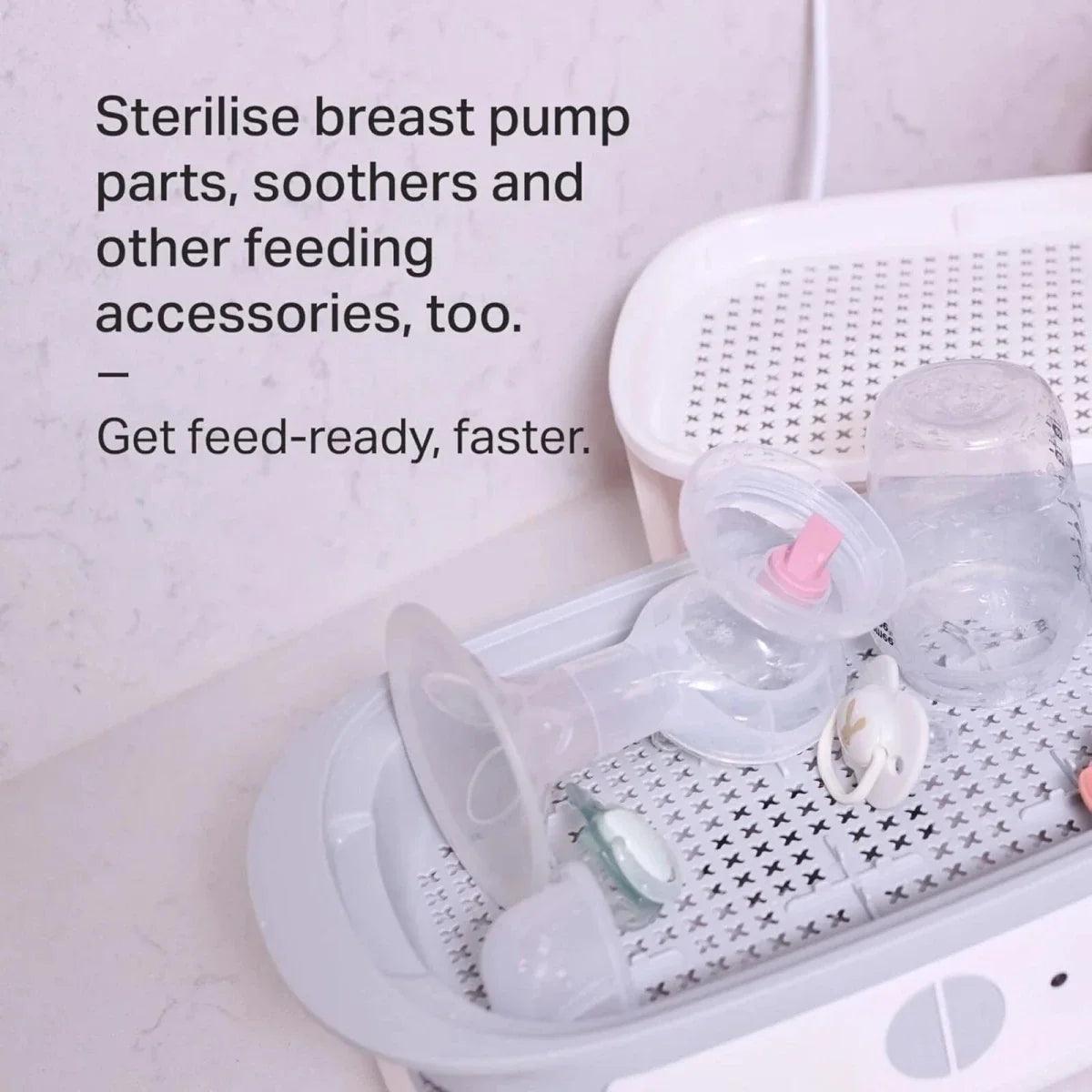 White steriliser basket holding breast pump parts and feeding accessories