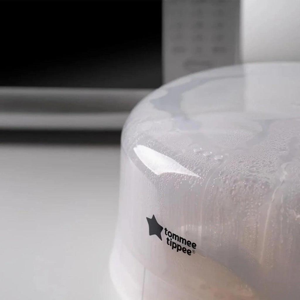 Tommee Tippee clear domed lid of microwave steam steriliser, close-up
