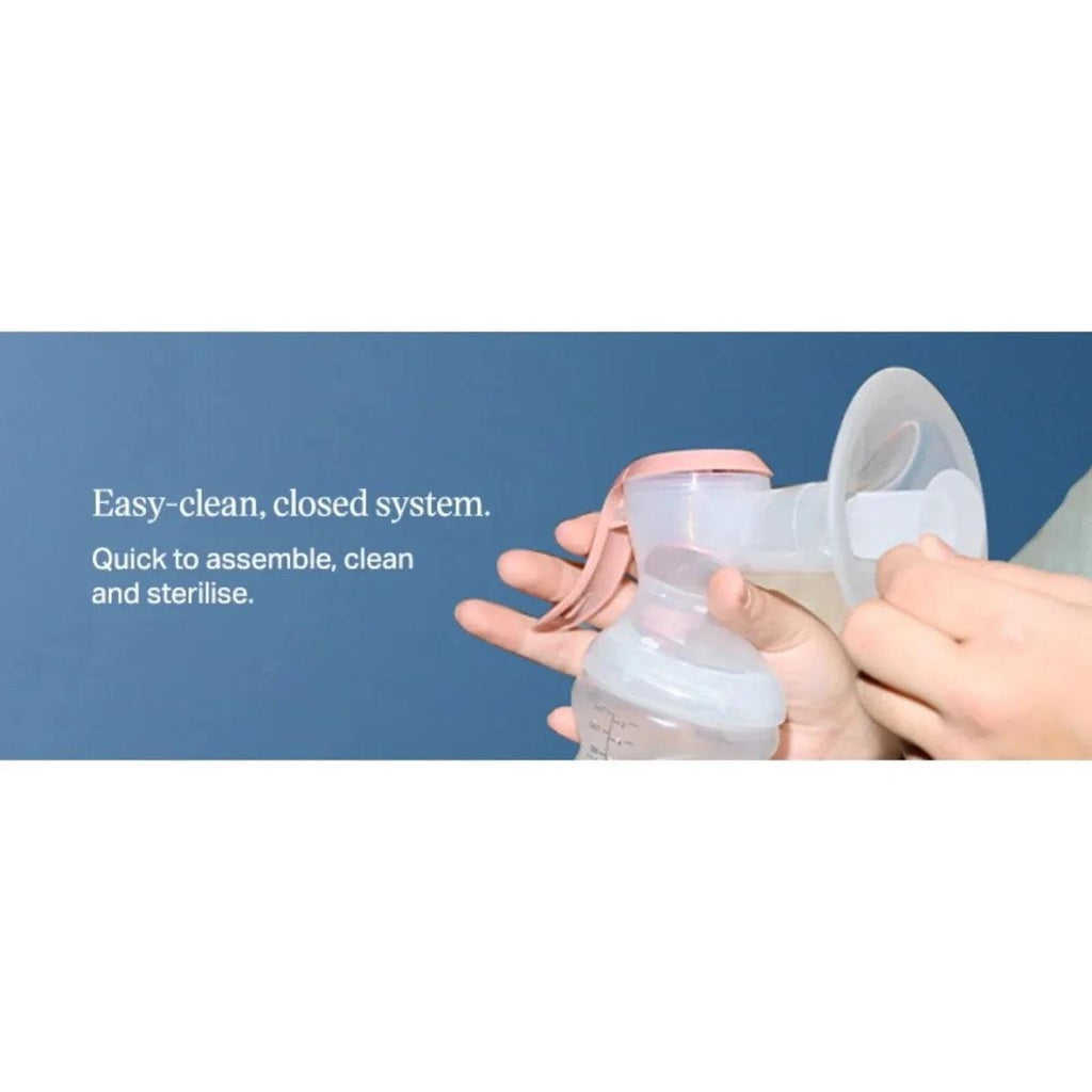 Manual breast pump with clear bottle and pink handle for easy-clean closed system