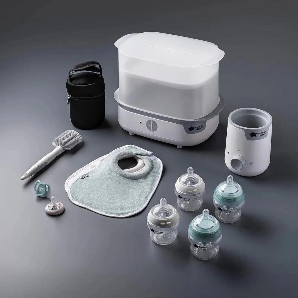 White electric steam steriliser set with bottle warmer, bottles, bib, brush, and bag