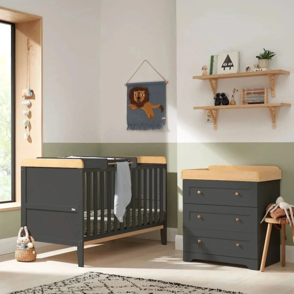 Slate dark gray cot bed with honey oak rail and matching 3-drawer dresser