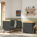 Slate dark gray cot bed with honey oak rail and matching 3-drawer dresser