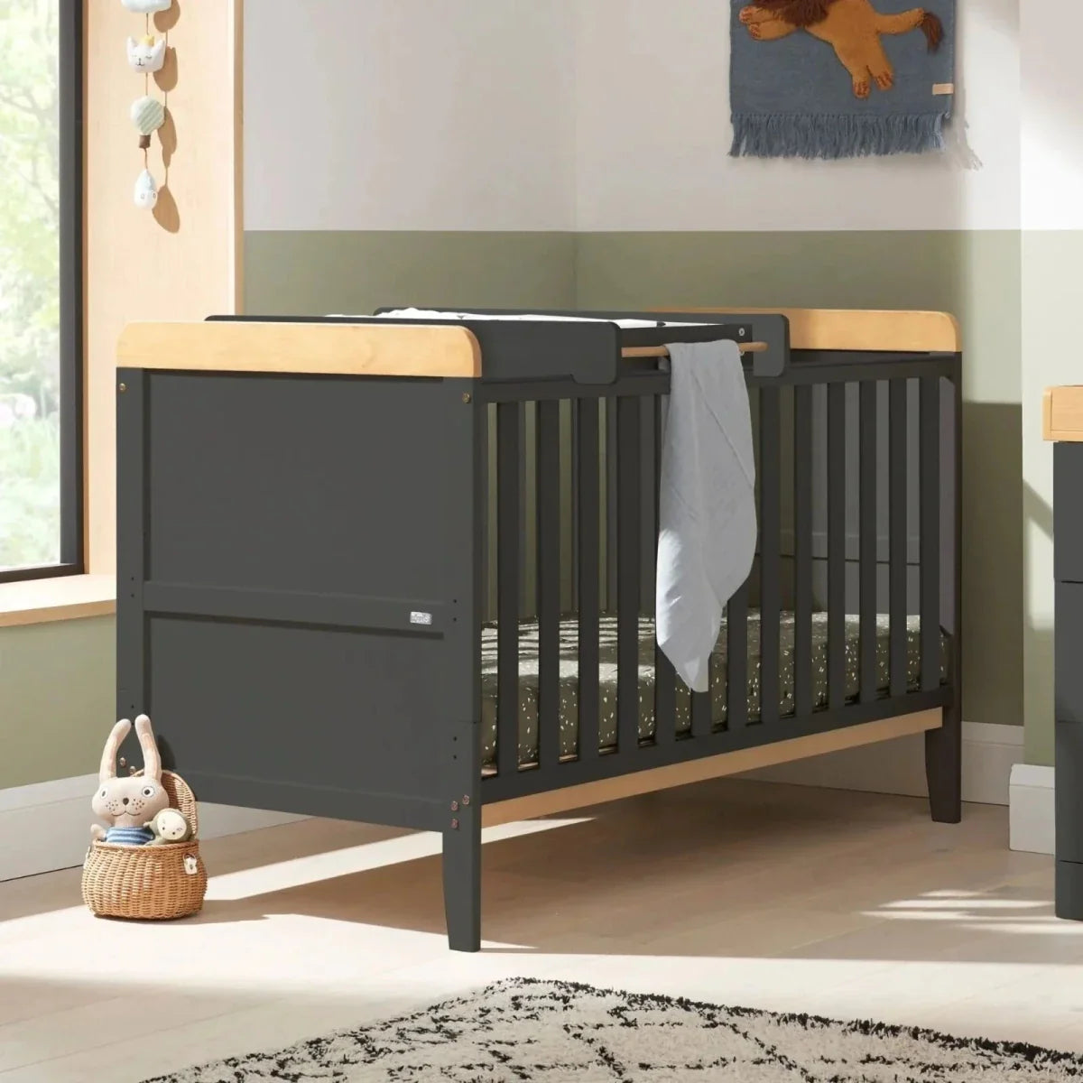 Dark slate cot bed with honey oak rails and vertical slats