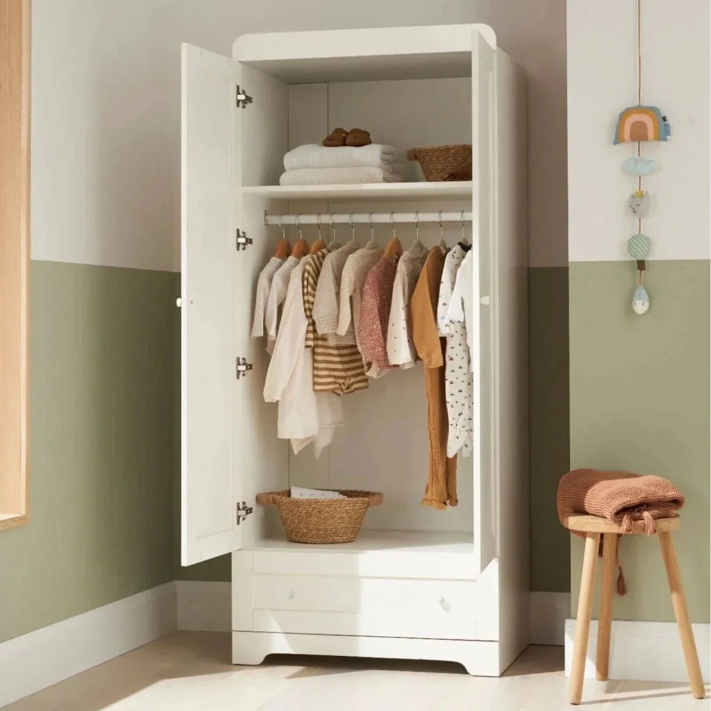 White wardrobe with open doors showing hanging clothes and shelves