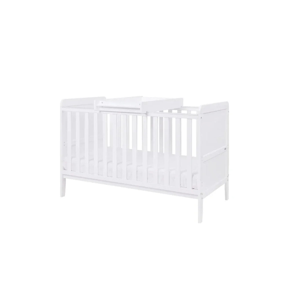 White cot bed with vertical guard rails and end panel detail