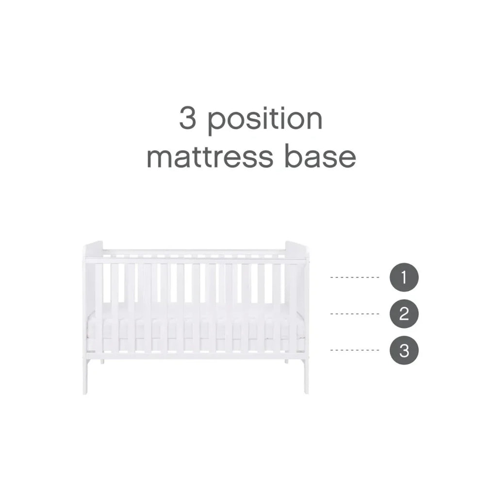 White cot bed showing 3 mattress base positions for different baby heights