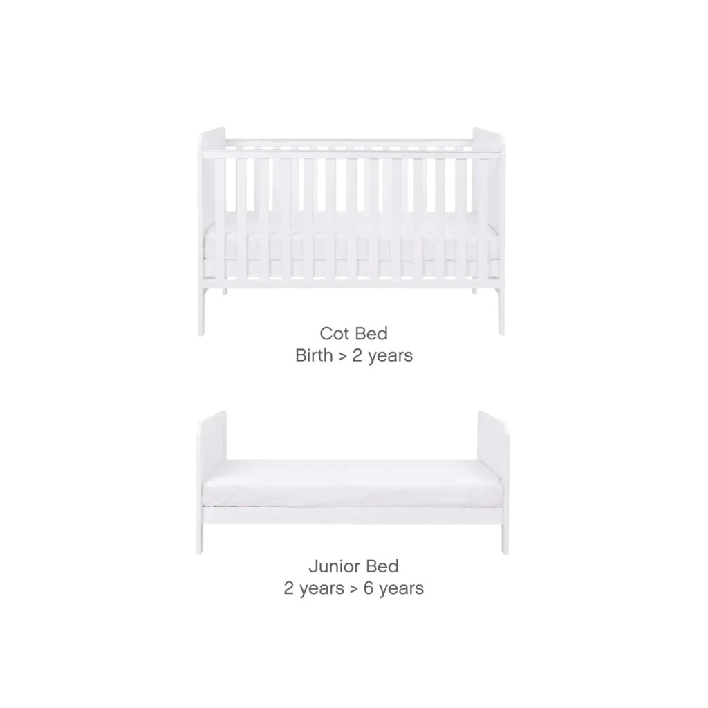 White cot bed conversion to junior bed, showing adjustable mattress base levels