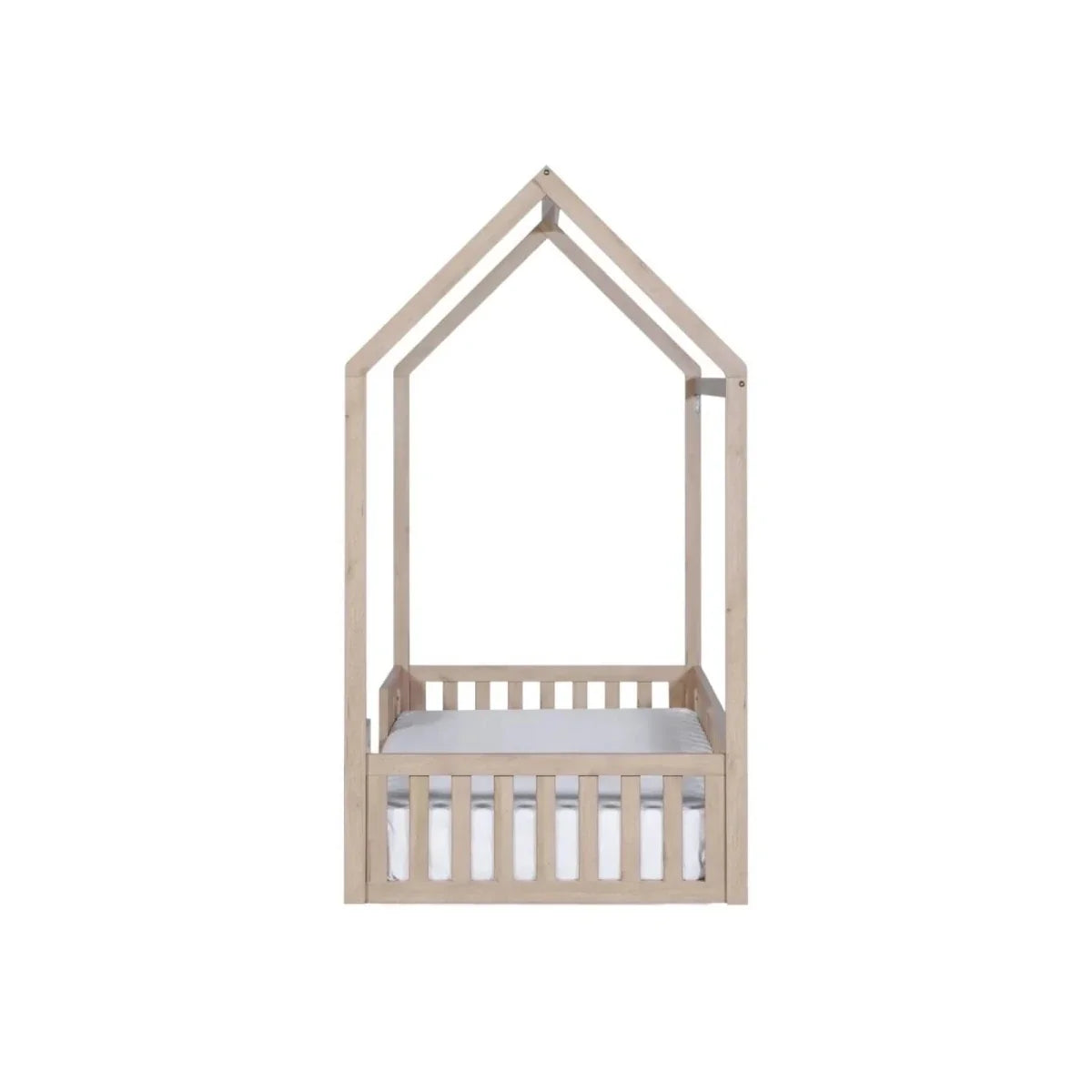 Oak house-shaped toddler floor bed frame with low guard rail and white mattress