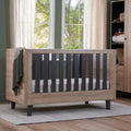 Distressed oak cot bed with slate grey slatted side panels and dark legs