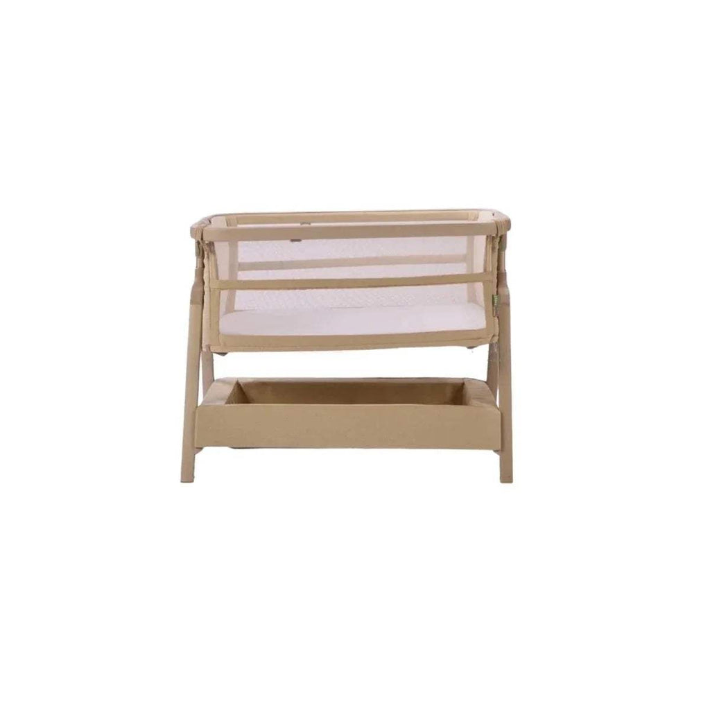 Sand bedside crib with raised end panels and open interior platform